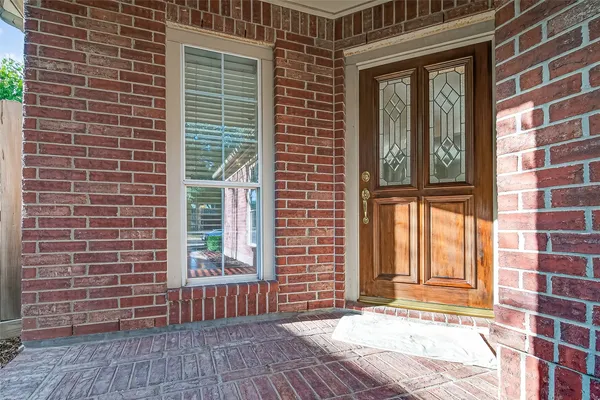 a view of a brick building with many windows