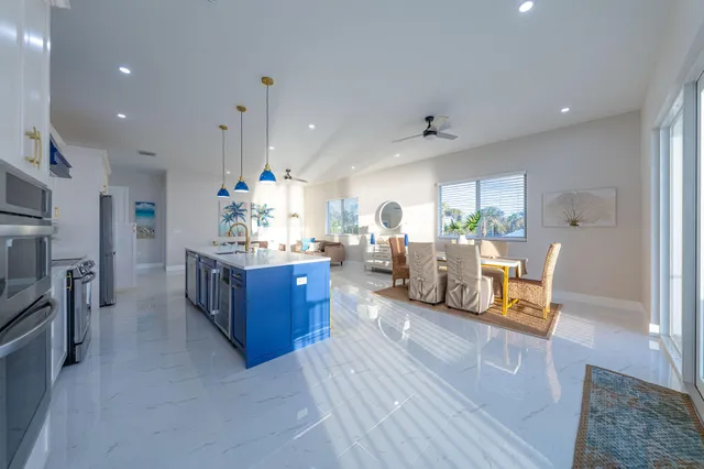 a bedroom with a bed and a large window with the outer view