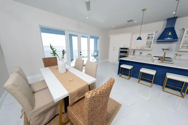 a living room with two bed and a couch