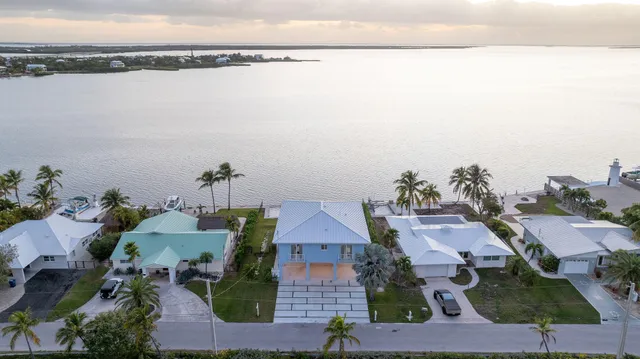 a stove top oven sitting inside of a kitchen