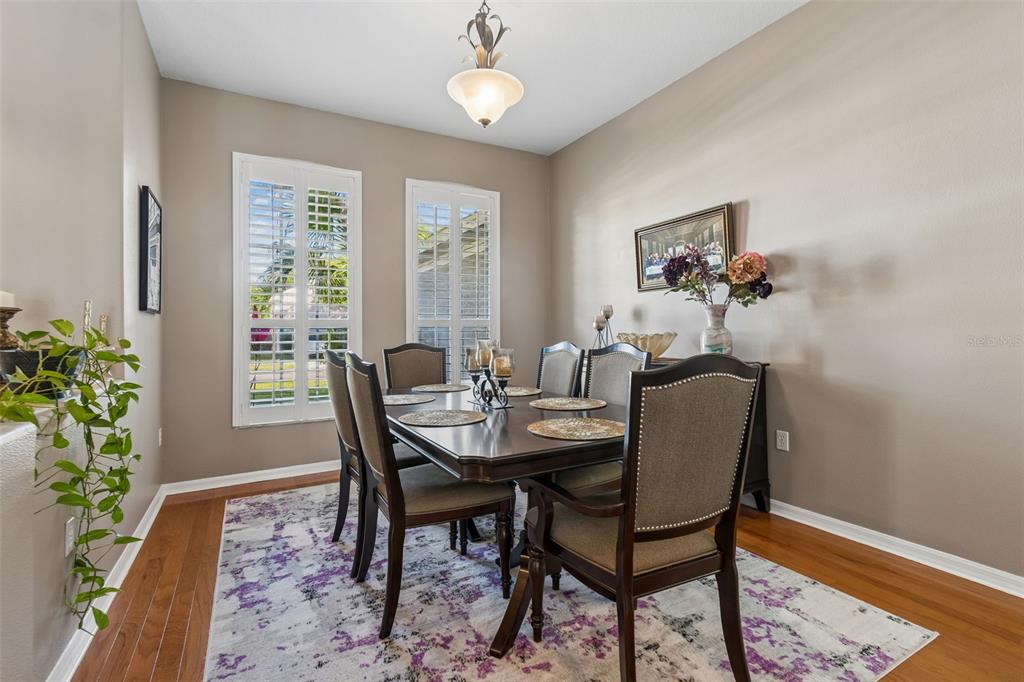 1602 Kish Boulevard Trinity, FL 34655 - Photo 11 of 65 a view of a dining room with furniture window and wooden floor