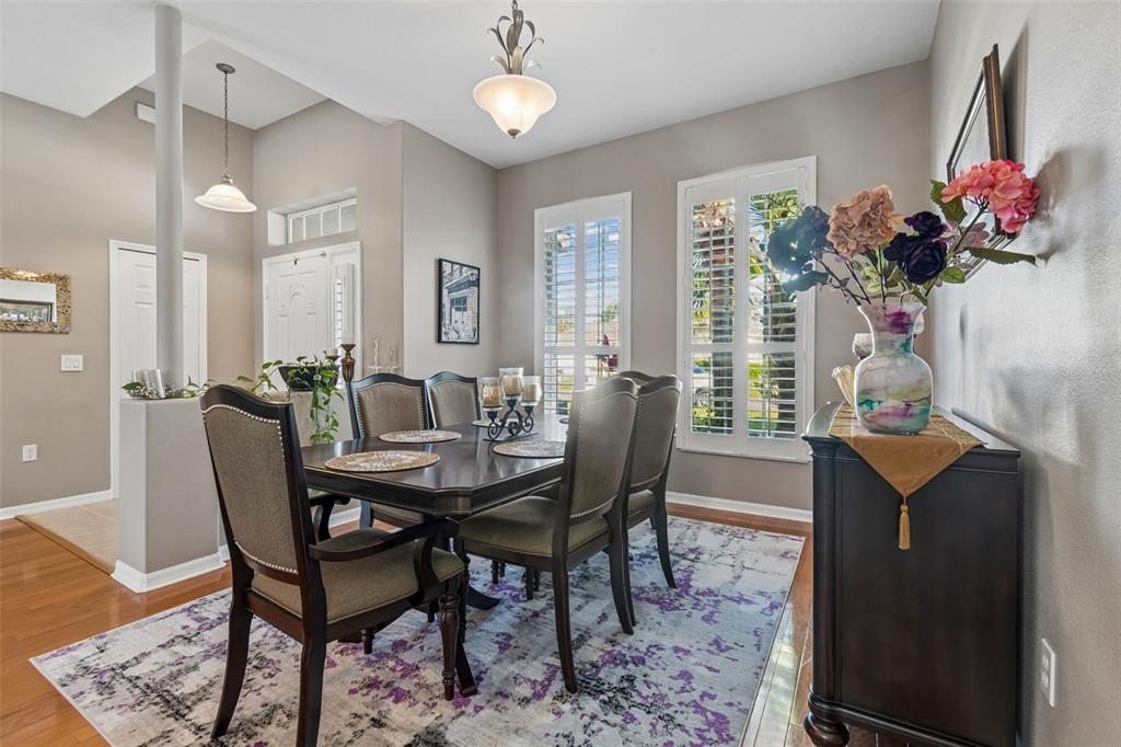 1602 Kish Boulevard Trinity, FL 34655 - Photo 12 of 65 a view of a dining room with furniture and a potted plant