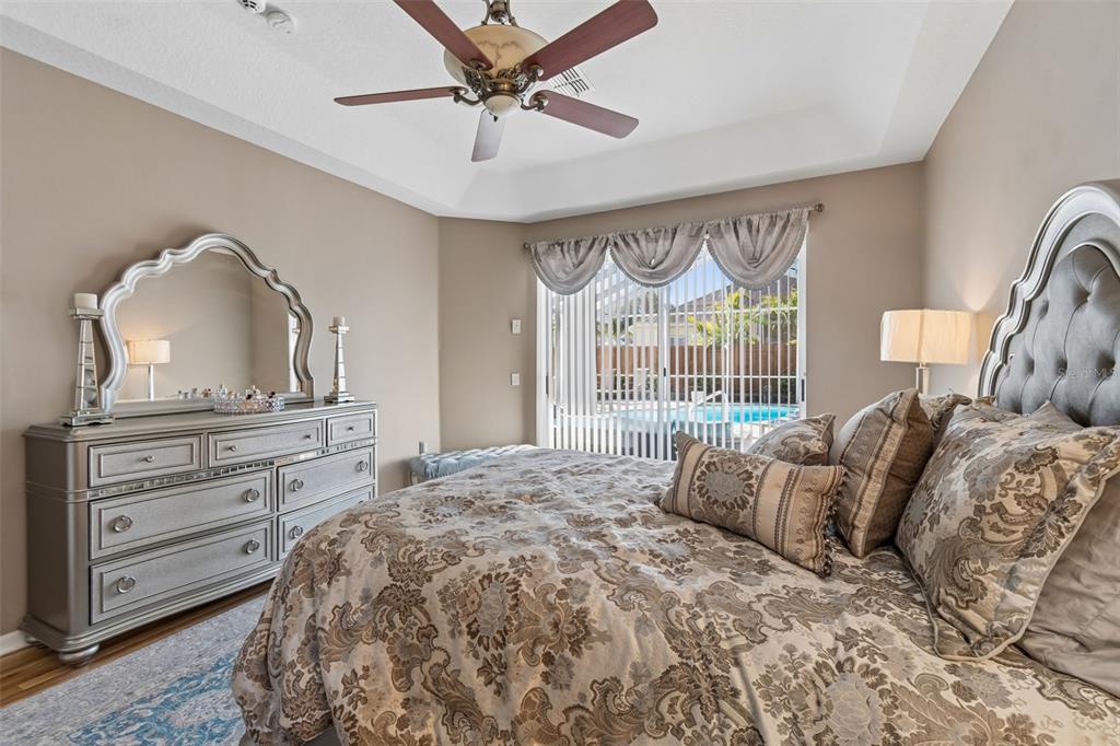 1602 Kish Boulevard Trinity, FL 34655 - Photo 19 of 65 a large bed sitting in a bedroom next to a window