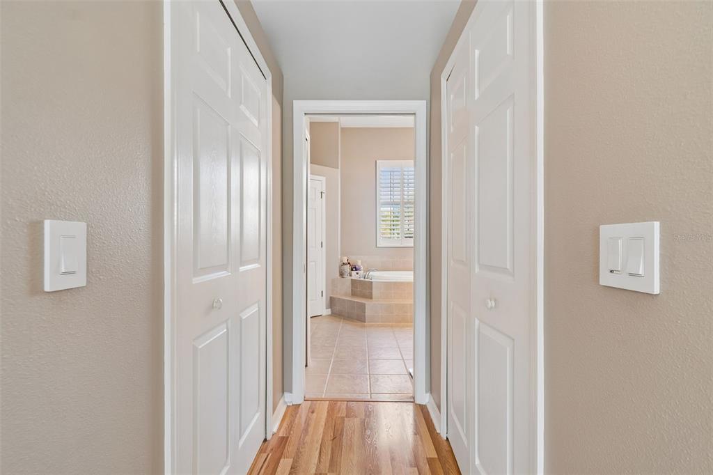 1602 Kish Boulevard Trinity, FL 34655 - Photo 20 of 65 a view of a hallway with wooden floor and a bathroom