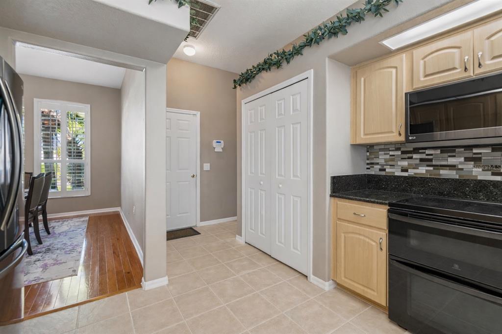 1602 Kish Boulevard Trinity, FL 34655 - Photo 27 of 65 a bathroom with a sink a large mirror and a bathtub
