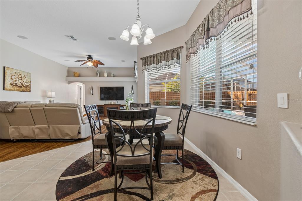 1602 Kish Boulevard Trinity, FL 34655 - Photo 29 of 65 a view of a dining room with furniture window and wooden floor
