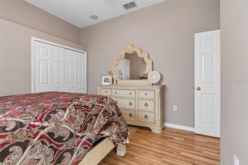 1602 Kish Boulevard Trinity, FL 34655 - Photo 36 of 65 a bedroom with a bed and a dresser