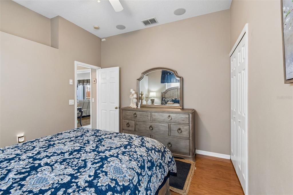 1602 Kish Boulevard Trinity, FL 34655 - Photo 42 of 65 a bedroom with a bed and a dresser