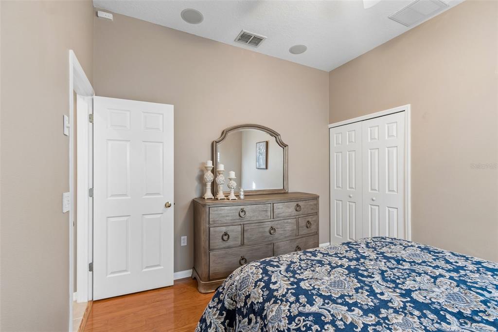 1602 Kish Boulevard Trinity, FL 34655 - Photo 43 of 65 a bedroom with a bed and a dresser