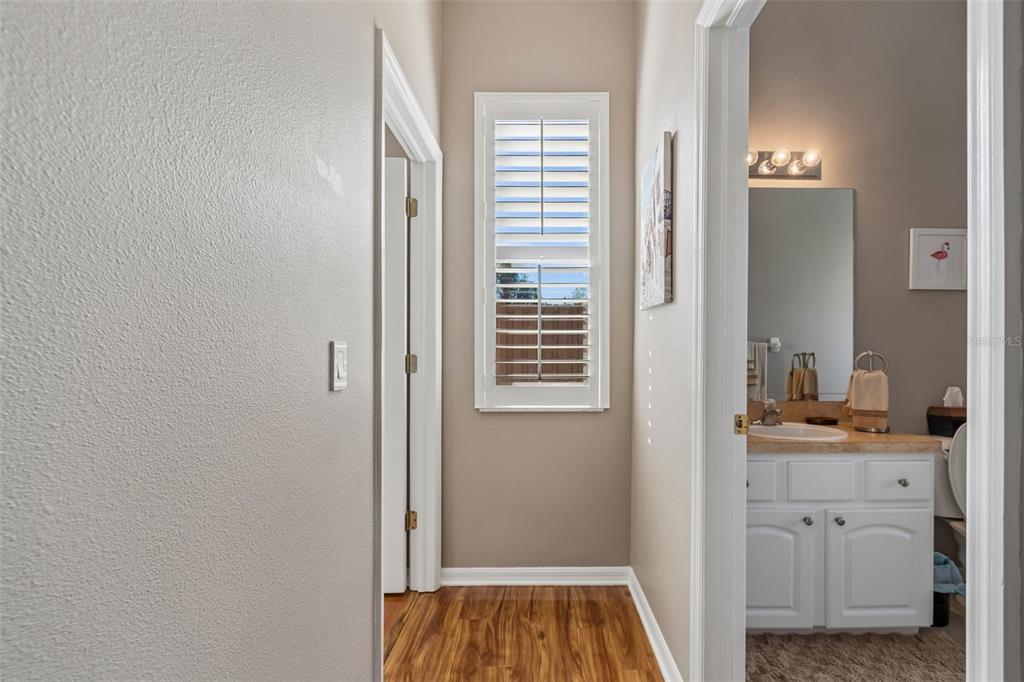 1602 Kish Boulevard Trinity, FL 34655 - Photo 49 of 65 a bathroom with a sink and a mirror