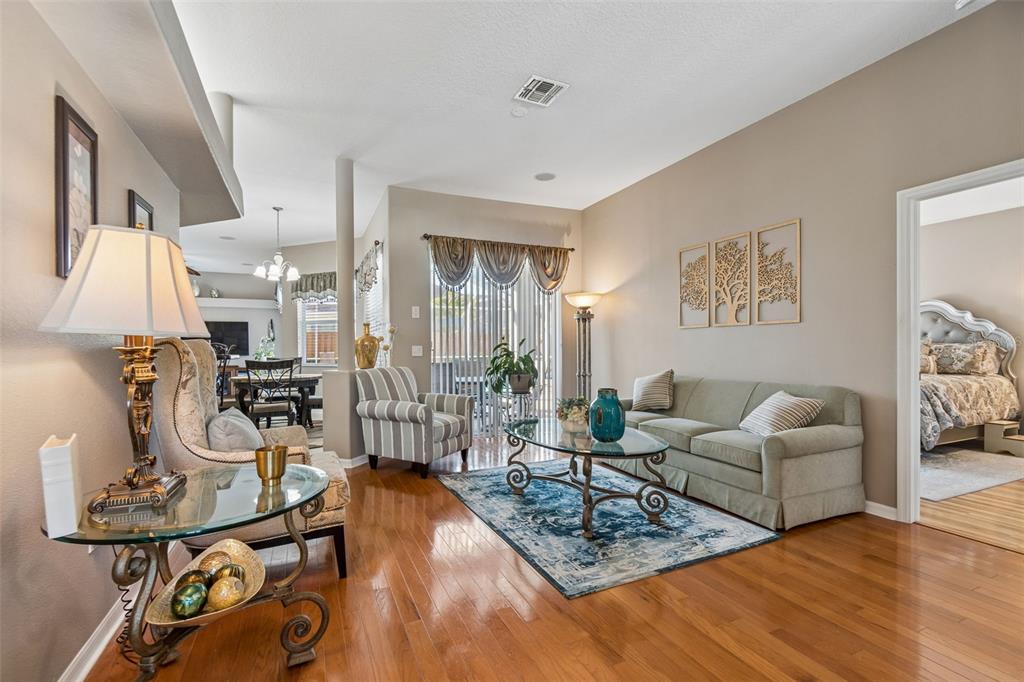 1602 Kish Boulevard Trinity, FL 34655 - Photo 6 of 65 a living room with furniture and wooden floor