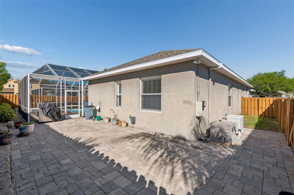 1602 Kish Boulevard Trinity, FL 34655 - Photo 62 of 65 a backyard of a house with yard and seating space