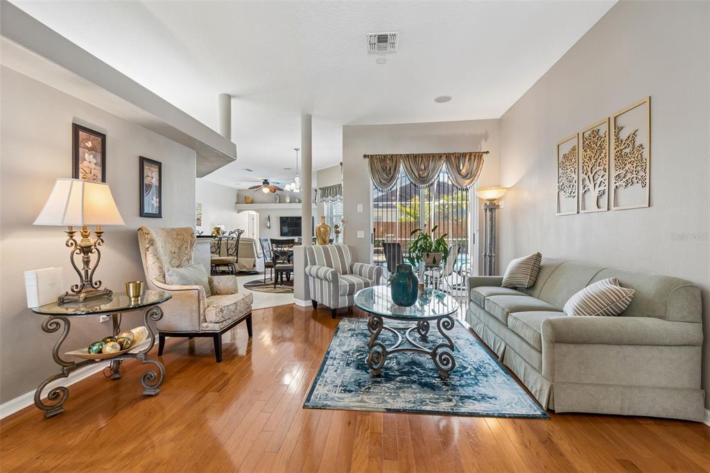 1602 Kish Boulevard Trinity, FL 34655 - Photo 7 of 65 a living room with furniture and a table