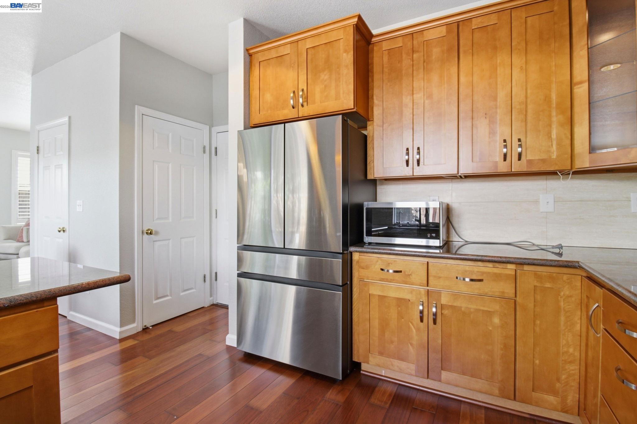 672 Greylyn Drive San Ramon, CA 94583 - Photo 13 of 35 a kitchen with a refrigerator sink and cabinets
