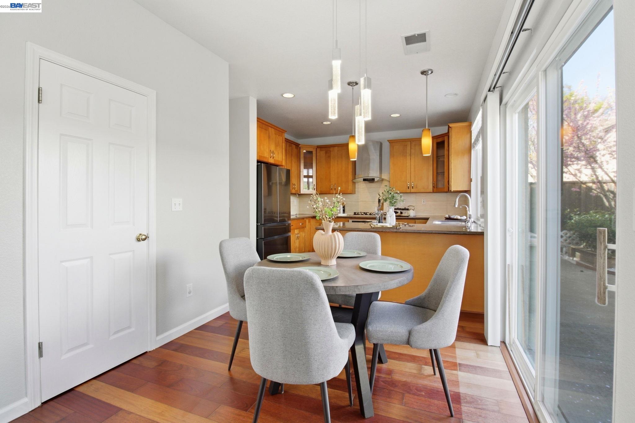 672 Greylyn Drive San Ramon, CA 94583 - Photo 16 of 35 a view of a dining room with furniture and wooden floor