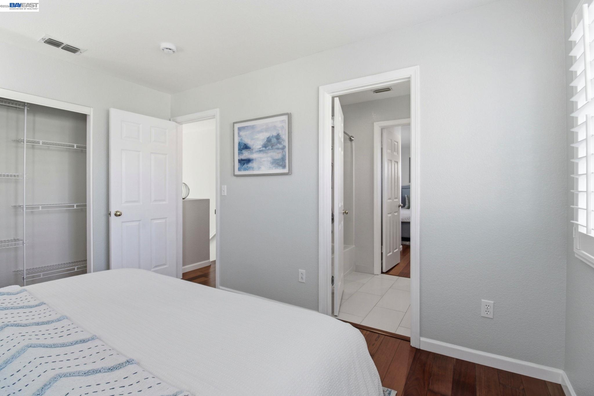 672 Greylyn Drive San Ramon, CA 94583 - Photo 19 of 35 a bedroom with a bed and painting on the wall