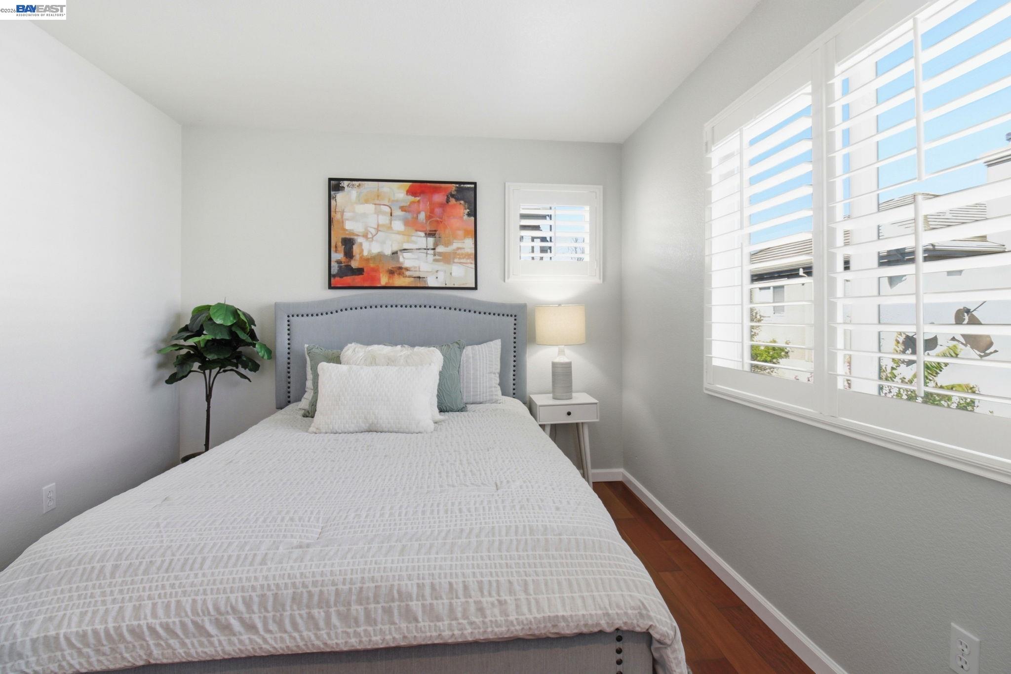 672 Greylyn Drive San Ramon, CA 94583 - Photo 20 of 35 a bedroom with a bed and a potted plant