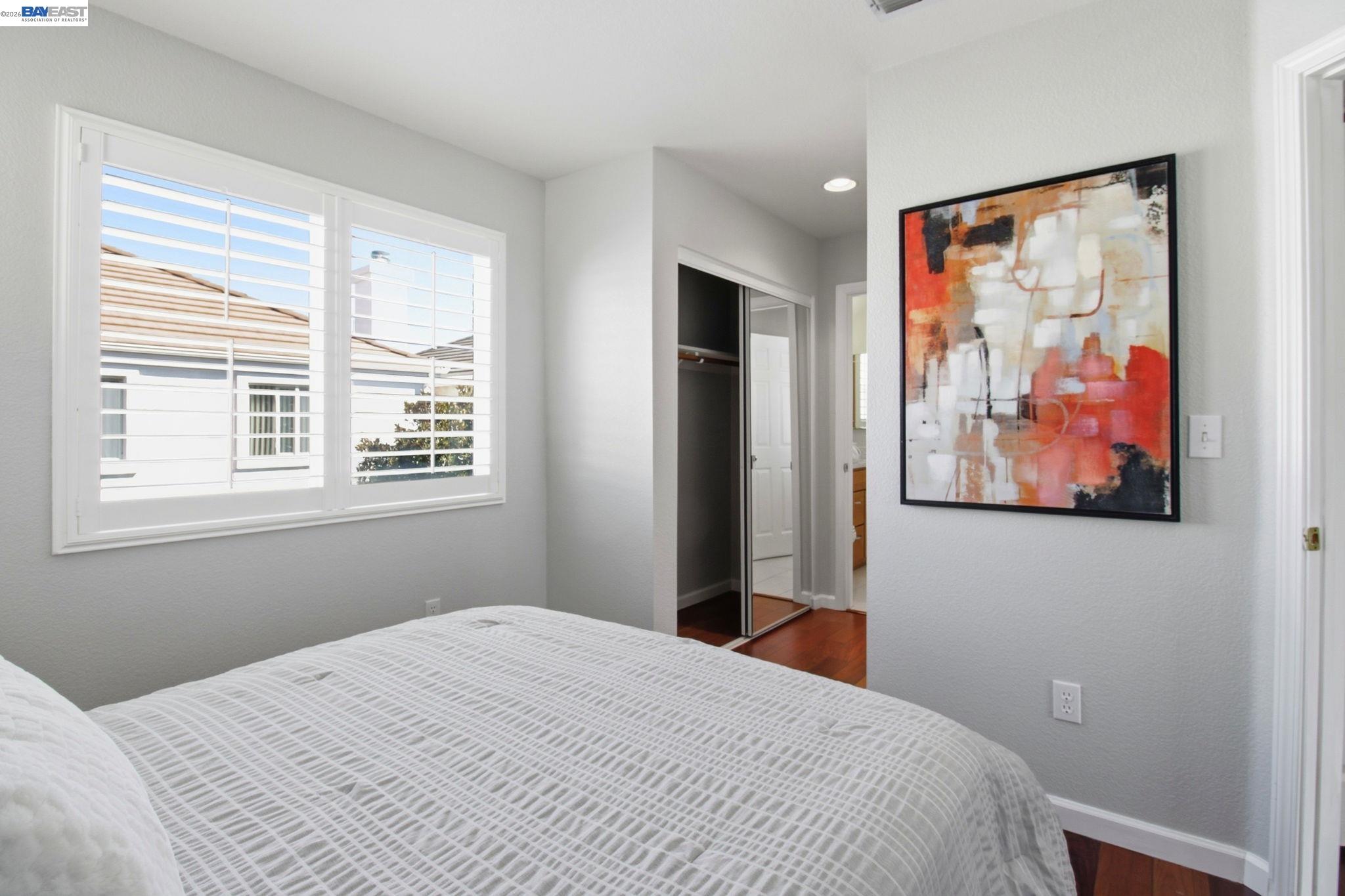 672 Greylyn Drive San Ramon, CA 94583 - Photo 21 of 35 a bedroom with a bed and wall painting