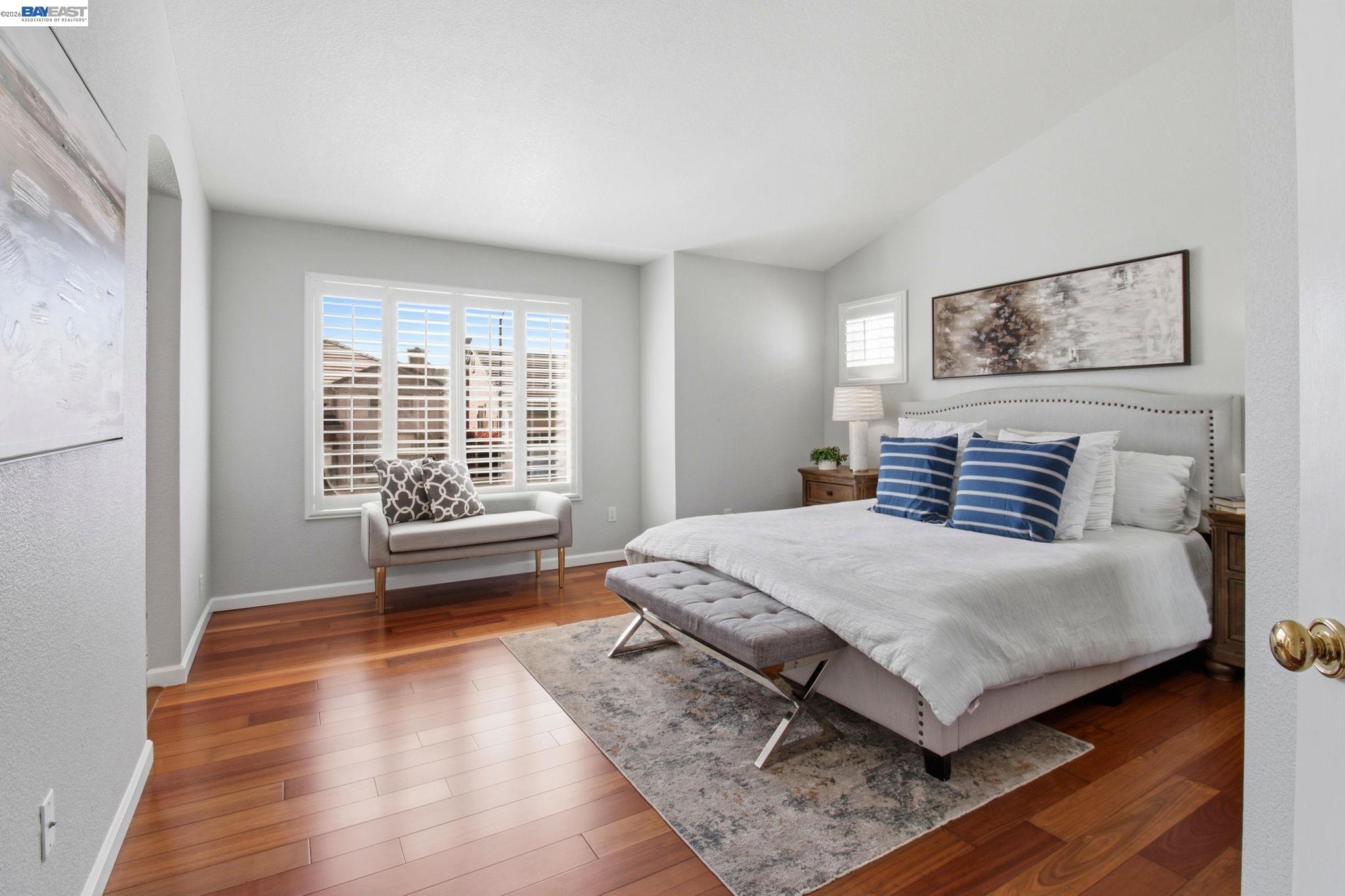 672 Greylyn Drive San Ramon, CA 94583 - Photo 22 of 35 a bedroom with a bed and wooden floor