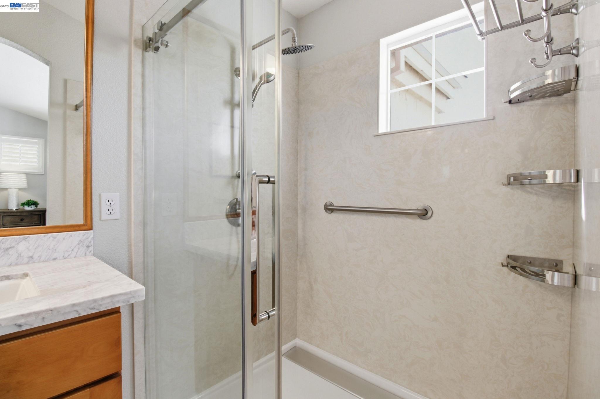 672 Greylyn Drive San Ramon, CA 94583 - Photo 25 of 35 a bathroom with a granite countertop shower sink vanity and mirror