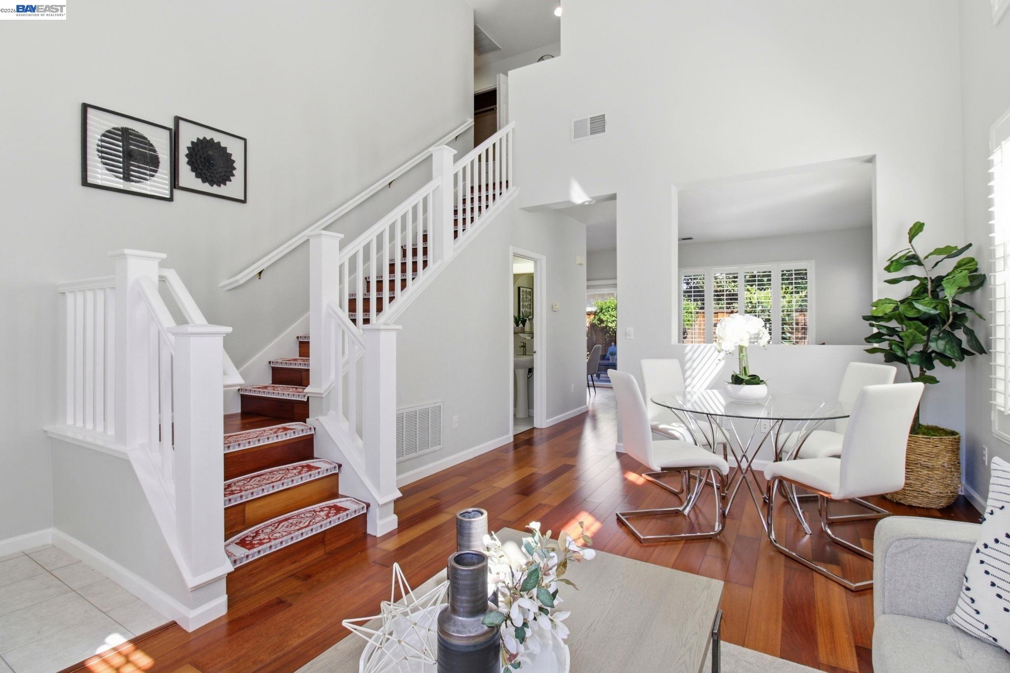 672 Greylyn Drive San Ramon, CA 94583 - Photo 5 of 35 a view of a dining room with furniture a potted plant and wooden floor