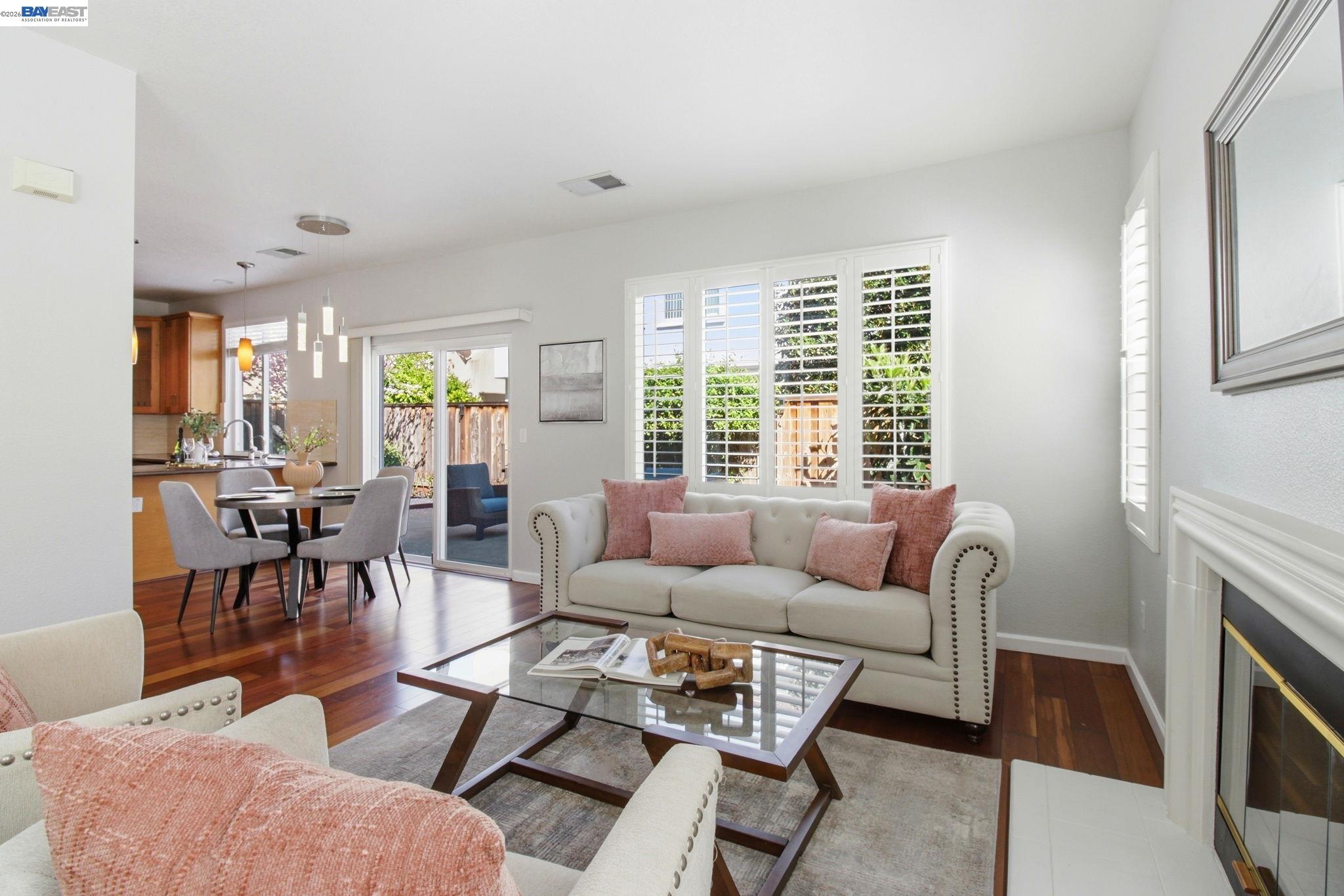 672 Greylyn Drive San Ramon, CA 94583 - Photo 8 of 35 a living room with furniture a fireplace and a large window