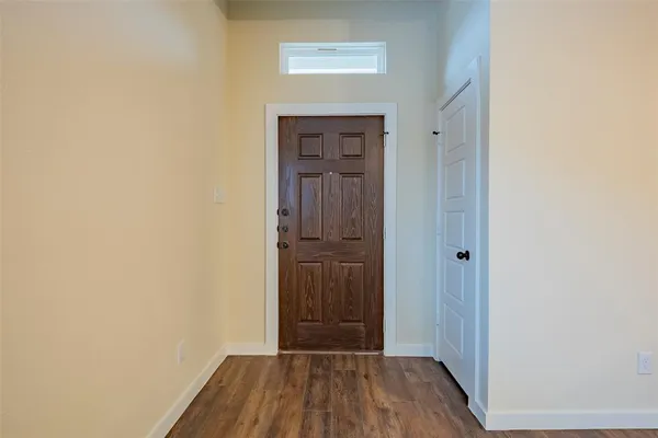 a view of a kitchen with a sink and a window