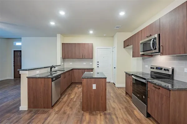 a kitchen with a sink a cabinetry and cabinets