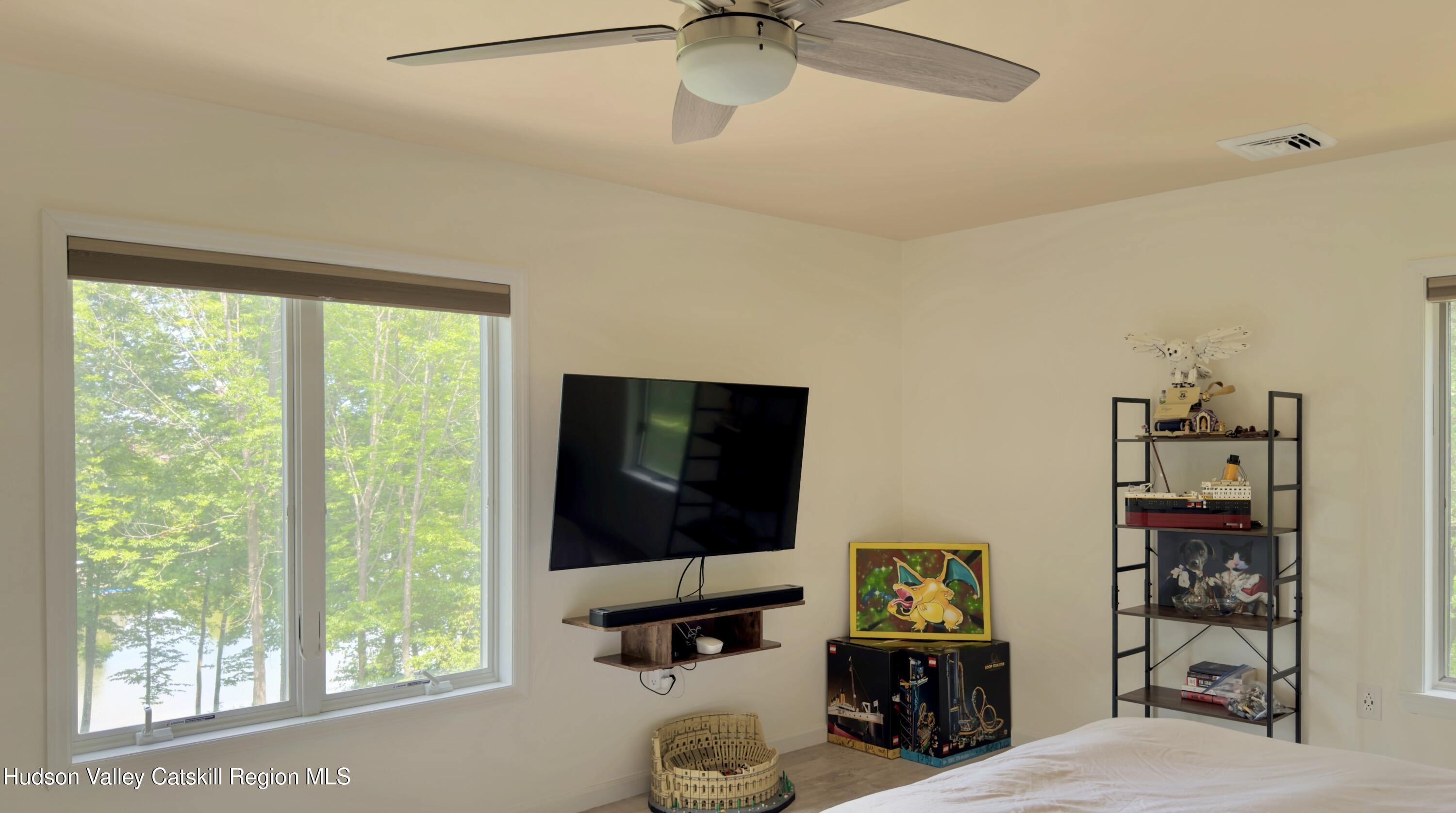 3223 Sleepy Hollow Road Athens, NY 12015 - Photo 23 of 55 a living room with furniture and a flat screen tv