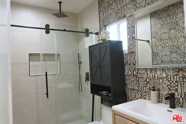 a bathroom with a sink and a shower
