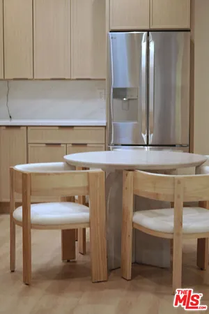 a kitchen with a sink and a refrigerator
