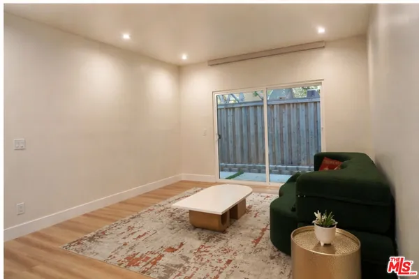 a living room with furniture and a gate