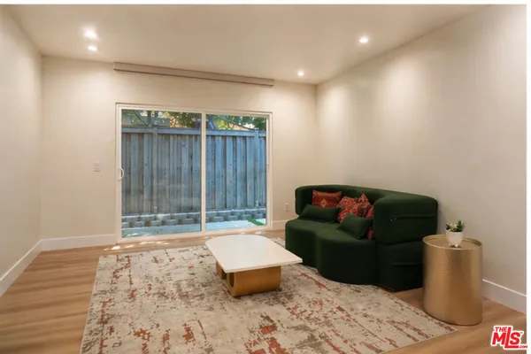 a living room with furniture and a gate