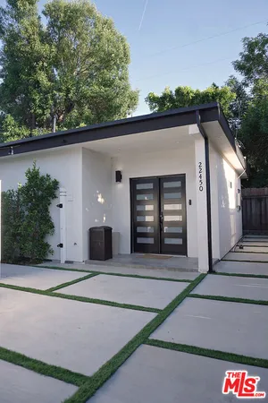 a view of front door and yard