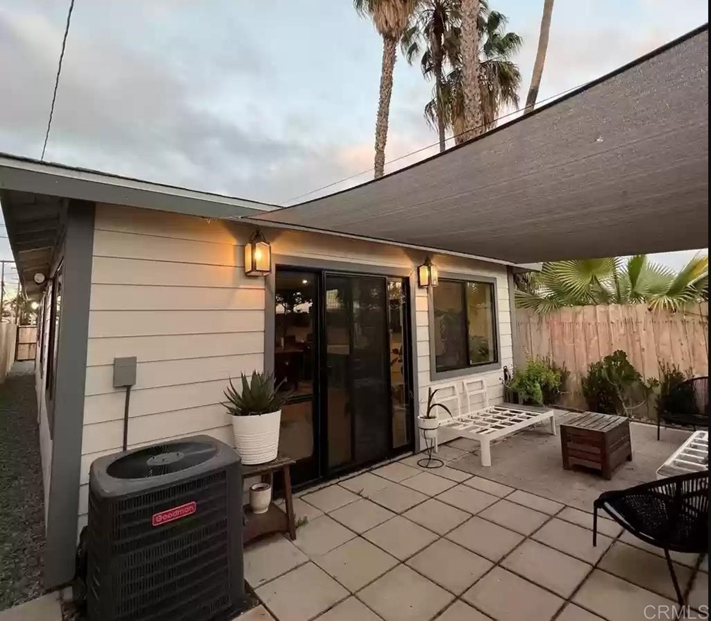 3928 El Cajon Boulevard San Diego, CA 92105 - Photo 2 of 4 a backyard of a house with barbeque oven table and chairs