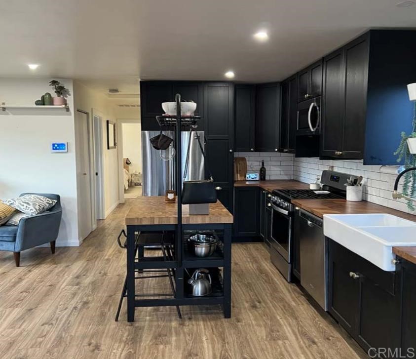 3928 El Cajon Boulevard San Diego, CA 92105 - Photo 4 of 4 a kitchen with kitchen island granite countertop lots of counter top space and stainless steel appliances