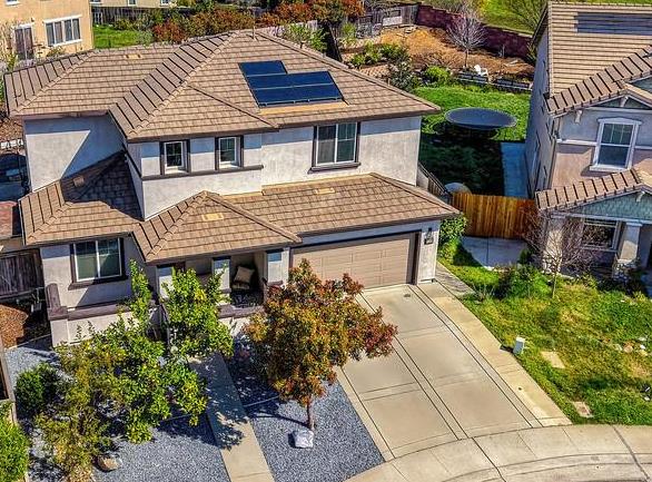 5409 Mill Water Circle Rancho Cordova, CA 95742 - Photo 1 of 48 a front view of a house with a garden