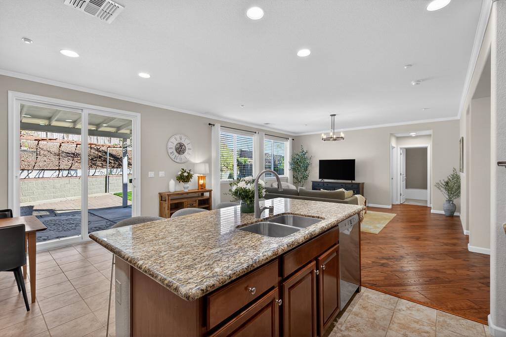 5409 Mill Water Circle Rancho Cordova, CA 95742 - Photo 21 of 48 a kitchen with sink and view of living room