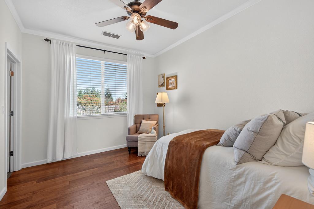 5409 Mill Water Circle Rancho Cordova, CA 95742 - Photo 28 of 48 a bedroom with a large bed and a window