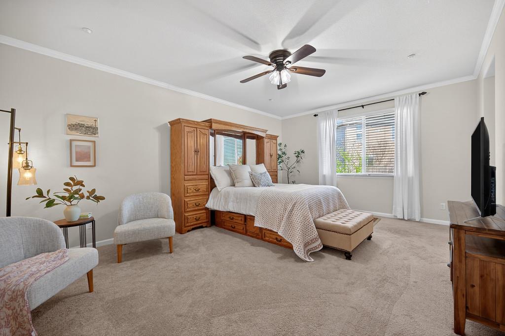 5409 Mill Water Circle Rancho Cordova, CA 95742 - Photo 30 of 48 a spacious bedroom with a bed and a flat screen television