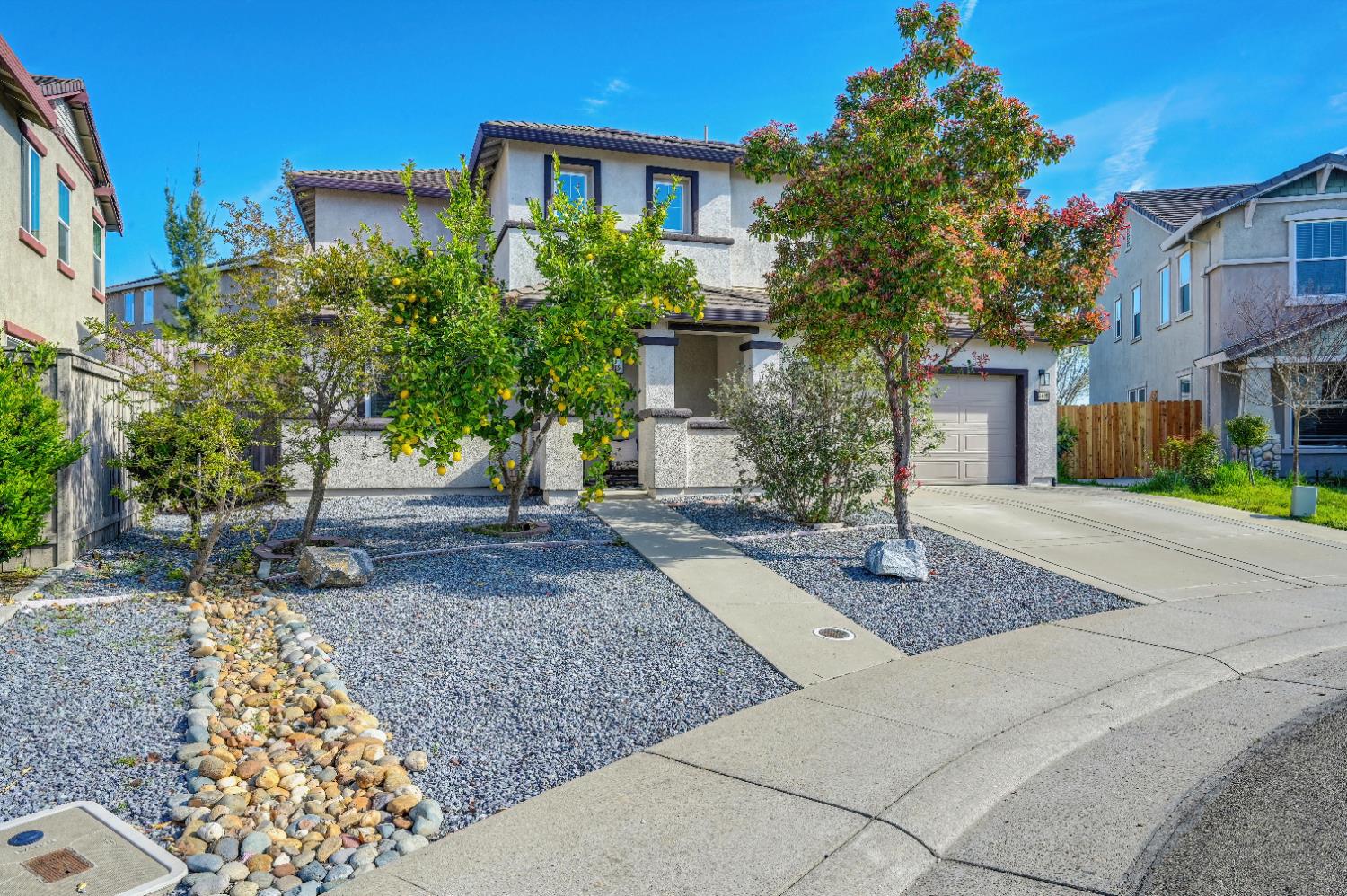5409 Mill Water Circle Rancho Cordova, CA 95742 - Photo 3 of 48 a front view of a house with garden