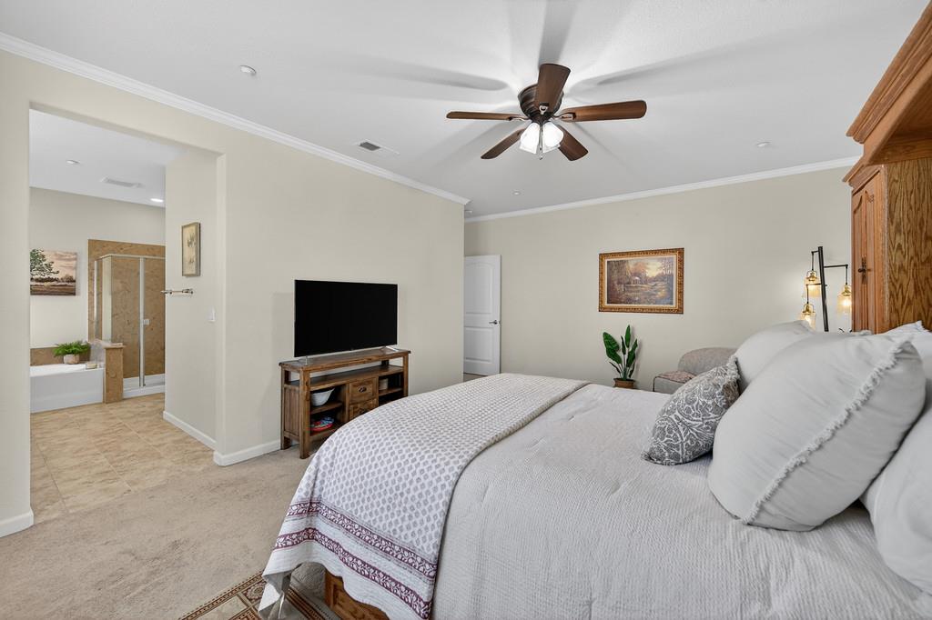 5409 Mill Water Circle Rancho Cordova, CA 95742 - Photo 32 of 48 a bedroom with a bed and a flat screen tv