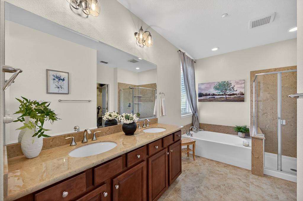 5409 Mill Water Circle Rancho Cordova, CA 95742 - Photo 34 of 48 a bathroom with a tub sink and mirror