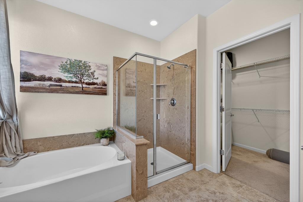 5409 Mill Water Circle Rancho Cordova, CA 95742 - Photo 35 of 48 a bathroom with a tub and shower
