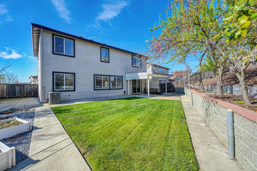 5409 Mill Water Circle Rancho Cordova, CA 95742 - Photo 39 of 48 a view of a house with a yard
