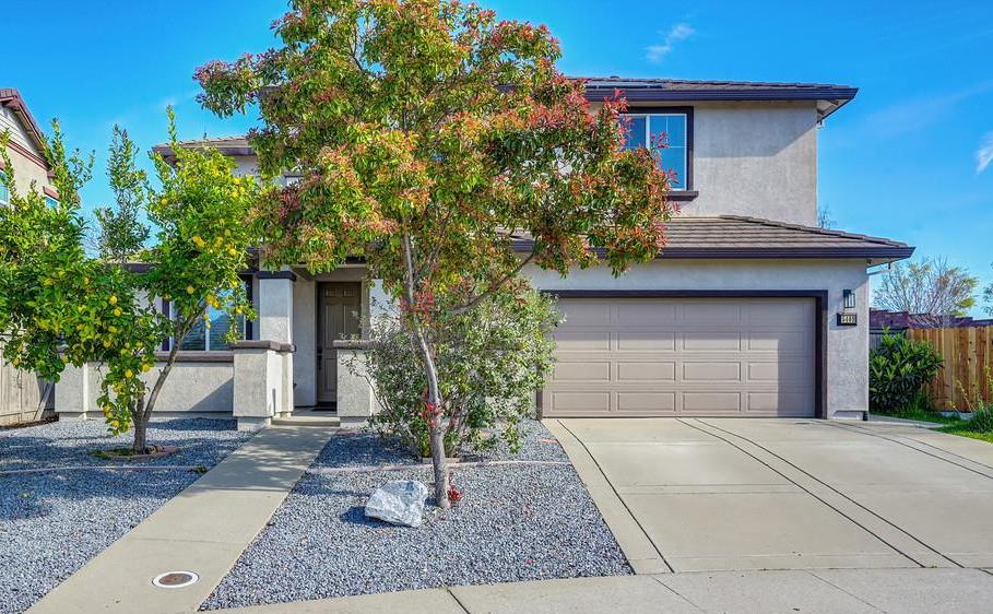 5409 Mill Water Circle Rancho Cordova, CA 95742 - Photo 4 of 48 a front view of a house with garden