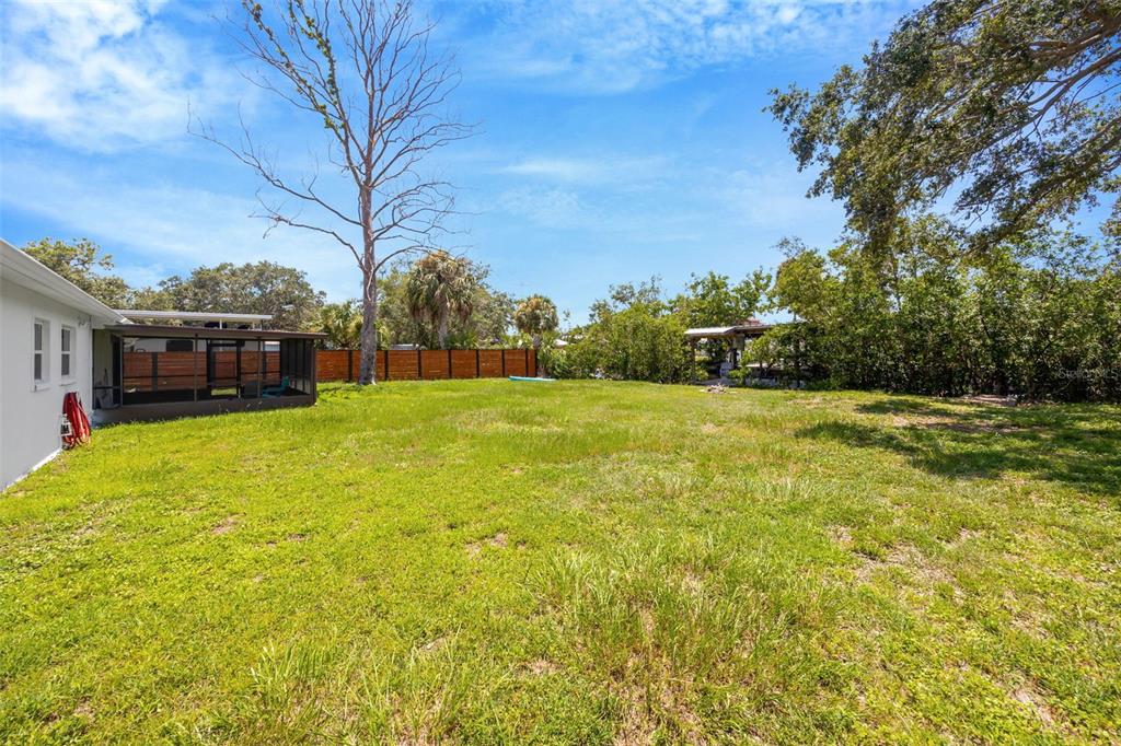 9935 River Drive Gibsonton, FL 33534 - Photo 26 of 29 a view of a house with a big yard