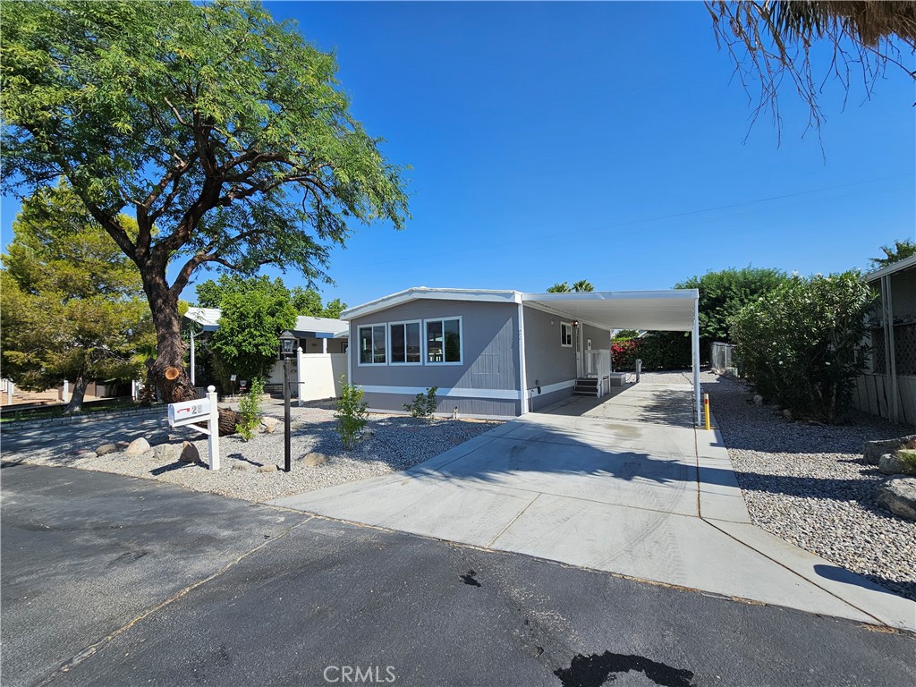 17555-2 Corkill Road, Unit 28 Desert Hot Springs, CA 92241 - Photo 1 of 1 a view of a house with backyard and sitting area