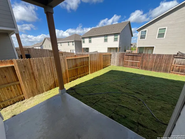 a view of swimming pool with a backyard
