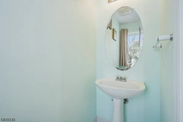a bedroom with a bed and a mirror